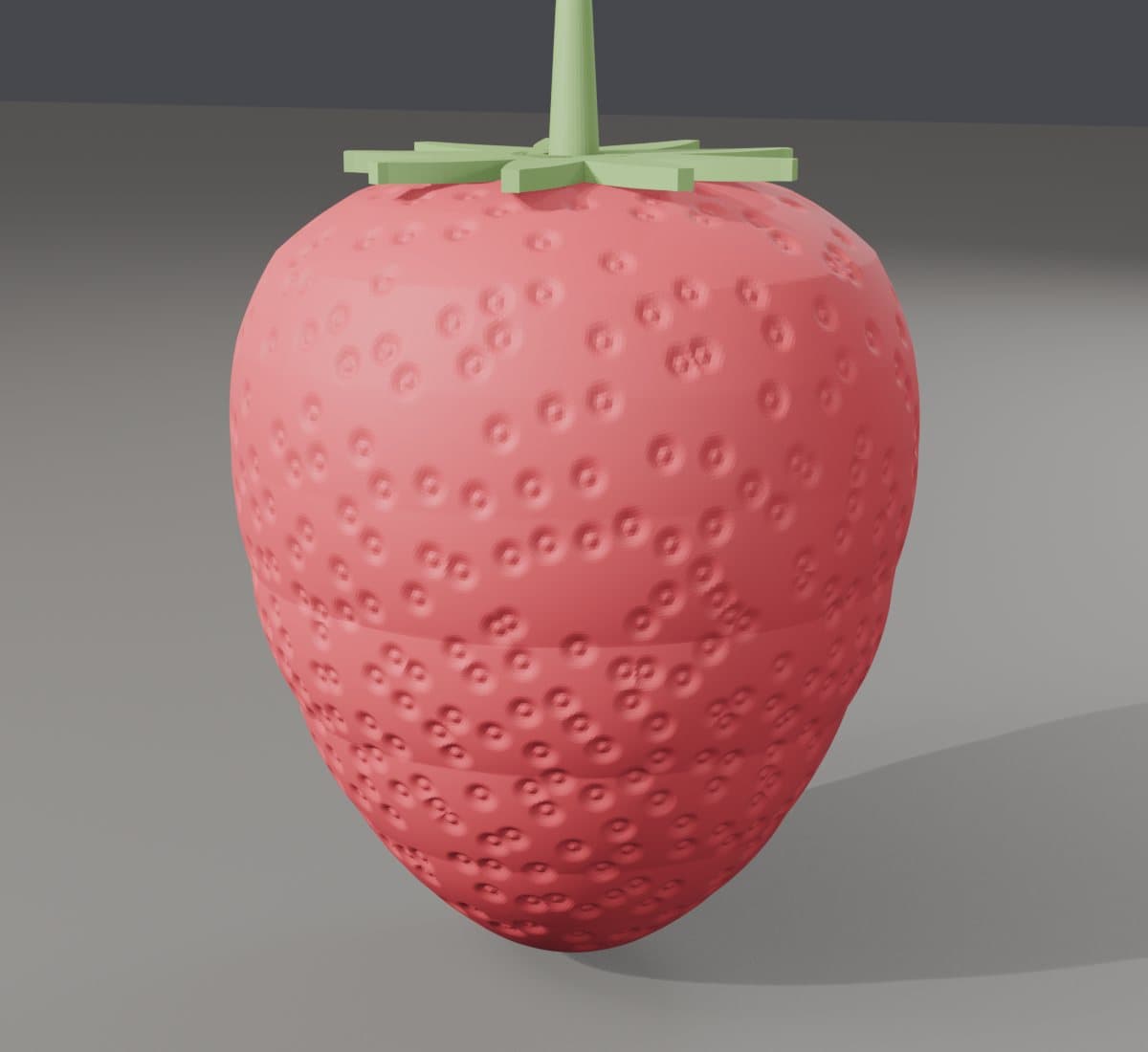 Frutta con la buccia vera: Una fragola coi semi in rilievo, uno per uno.